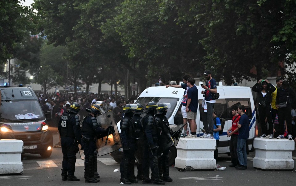 French riot police facing PSG fans during a riot.