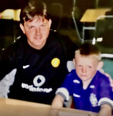 Photo of a man and a young boy.