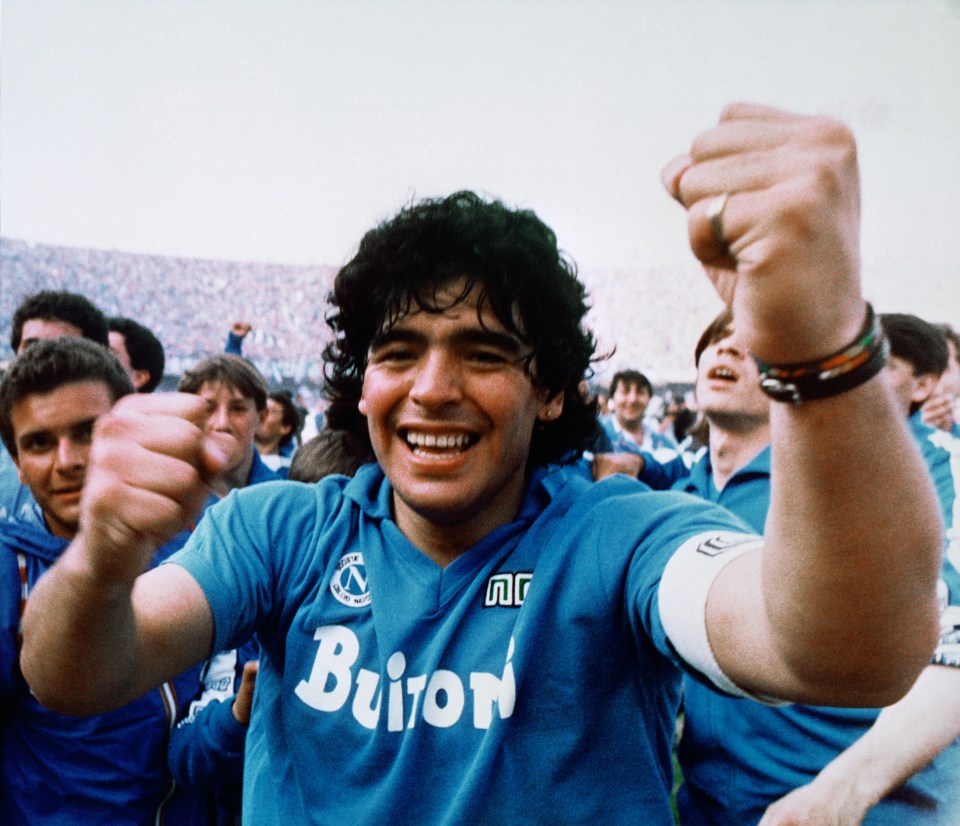 Diego Maradona celebrating with his Napoli teammates after winning the Italian major league title.