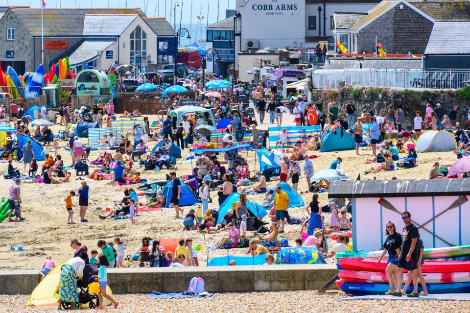 Crowded beach in Lyme Regis, Dorset, UK.