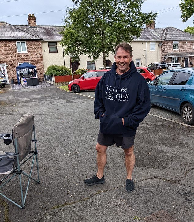 Phillips pictured in a Help for Heroes hoodie during a street party held for the late Queen's Diamond Jubilee. He is said to have played a DJ set at the event