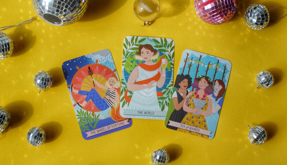 Illustration of three tarot cards: The Wheel of Fortune, The World, and Six of Wands, surrounded by disco balls.