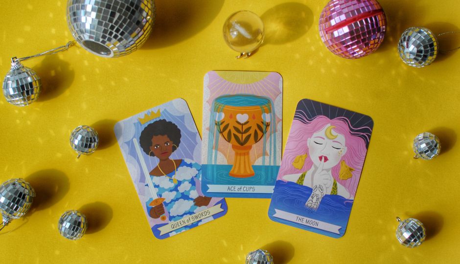 Illustration of three tarot cards (Queen of Swords, Ace of Cups, The Moon) surrounded by disco balls.