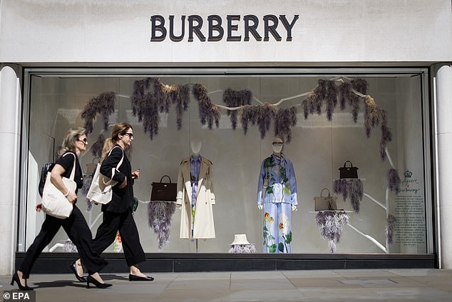 Two women walk past a Burberry branch on New Bond Street in London on May 14, 2025