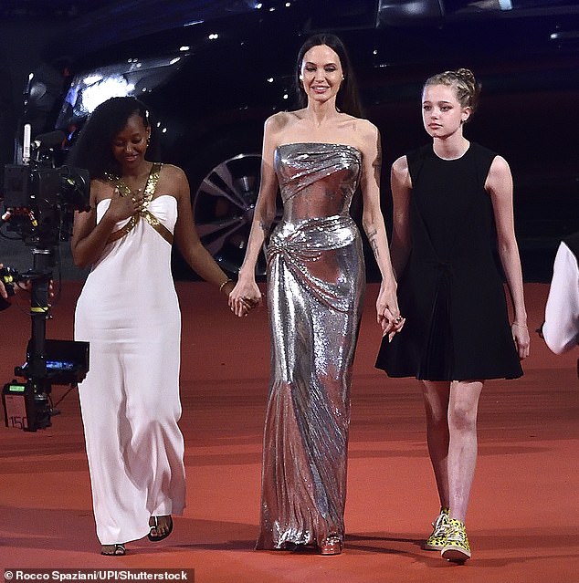 Five of the Maria actress and Brad's kids appear to be estranged from him including his daughters - Zahara (L, pictured in 2021), 20; Shiloh (R), turning 19 on May 27; and Vivienne - who've all publicly dropped his surname Pitt from their names