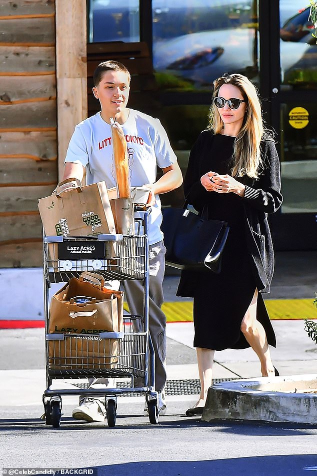 Angelina Jolie's son Knox Léon Jolie-Pitt towered over her during a grocery trip to Lazy Acres Natural Market in LA's trendy Los Feliz neighborhood on Thursday