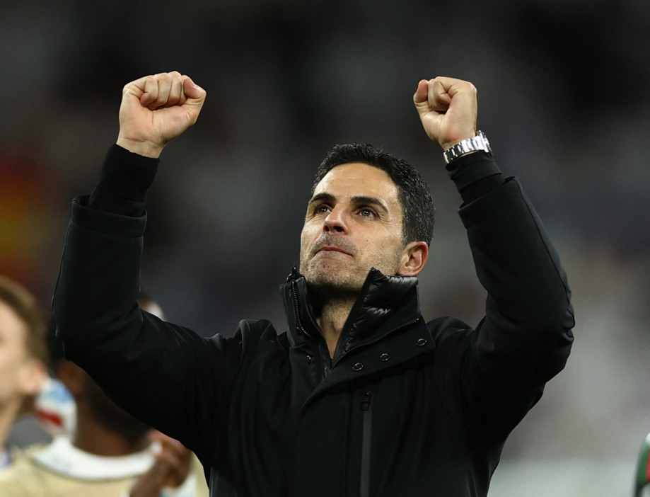 Soccer Football - Champions League - Quarter Final - Second Leg - Real Madrid v Arsenal - Santiago Bernabeu, Madrid, Spain - April 16, 2025 Arsenal manager Mikel Arteta celebrates after the match Action Images via Reuters/Lee Smith