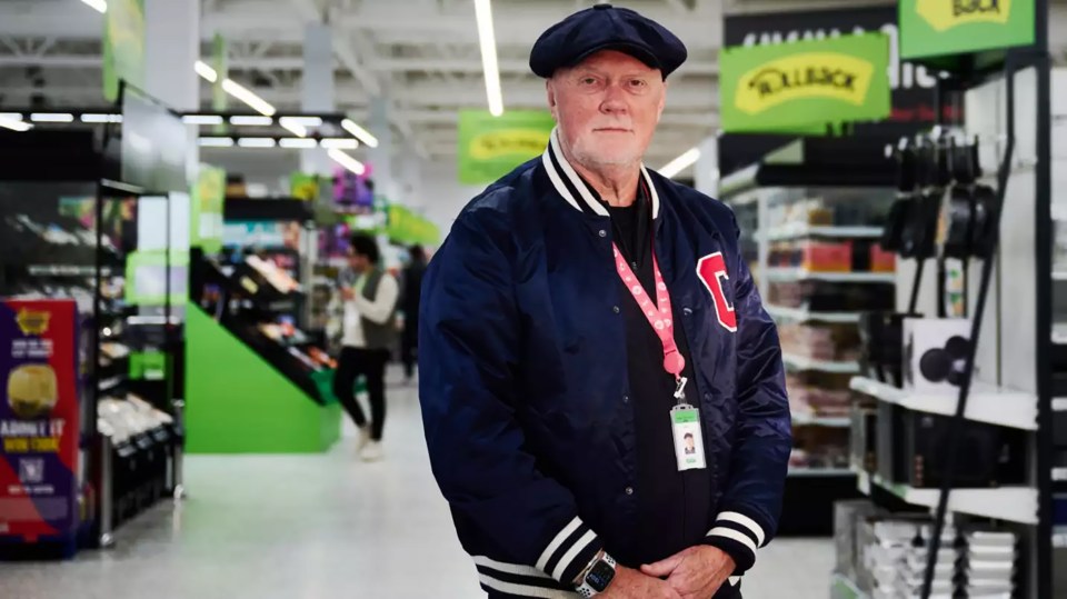 Allan Leighton, Executive Chairman of Asda, standing in an Asda store.