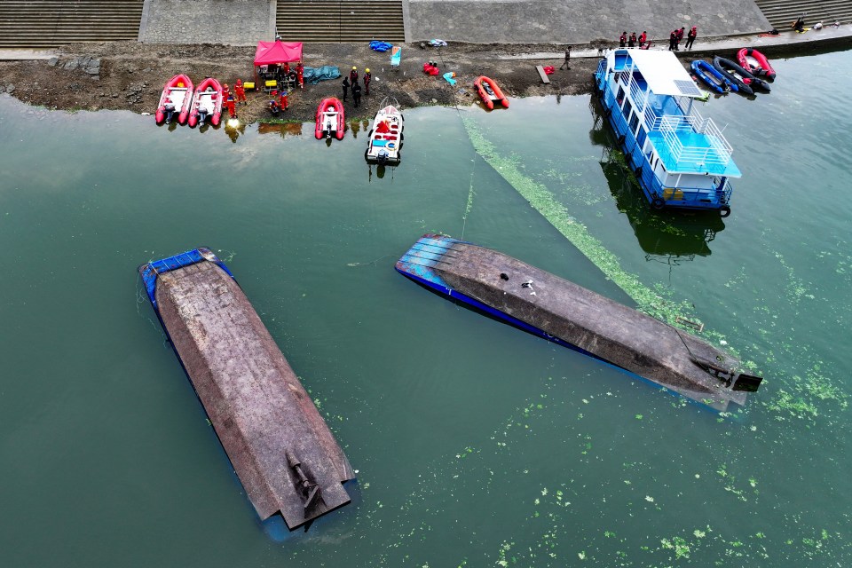 Aerial view of a search and rescue operation at a capsized boat accident site.