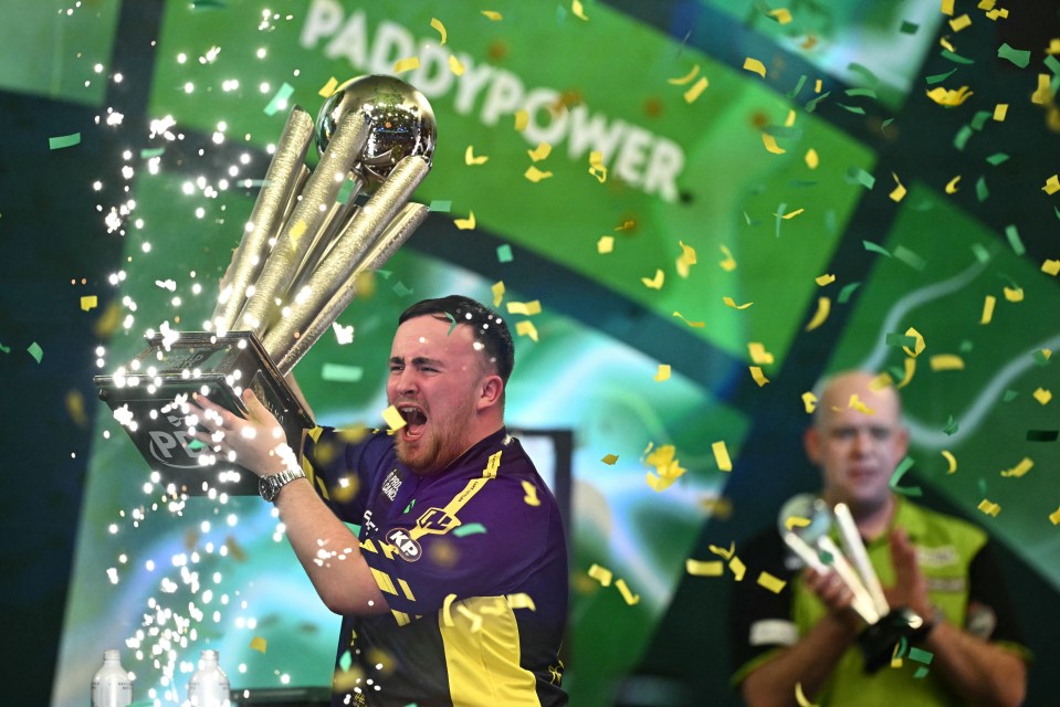 Luke Littler celebrates winning the PDC World Darts Championship.