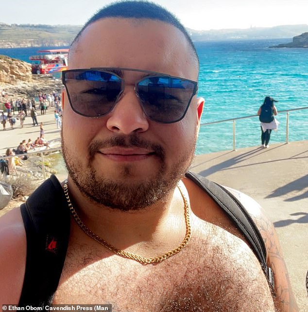 A beautician who spat at and called Ethan Obom (pictured) the N-word 25 times after he refused her entry to a club has avoided jail