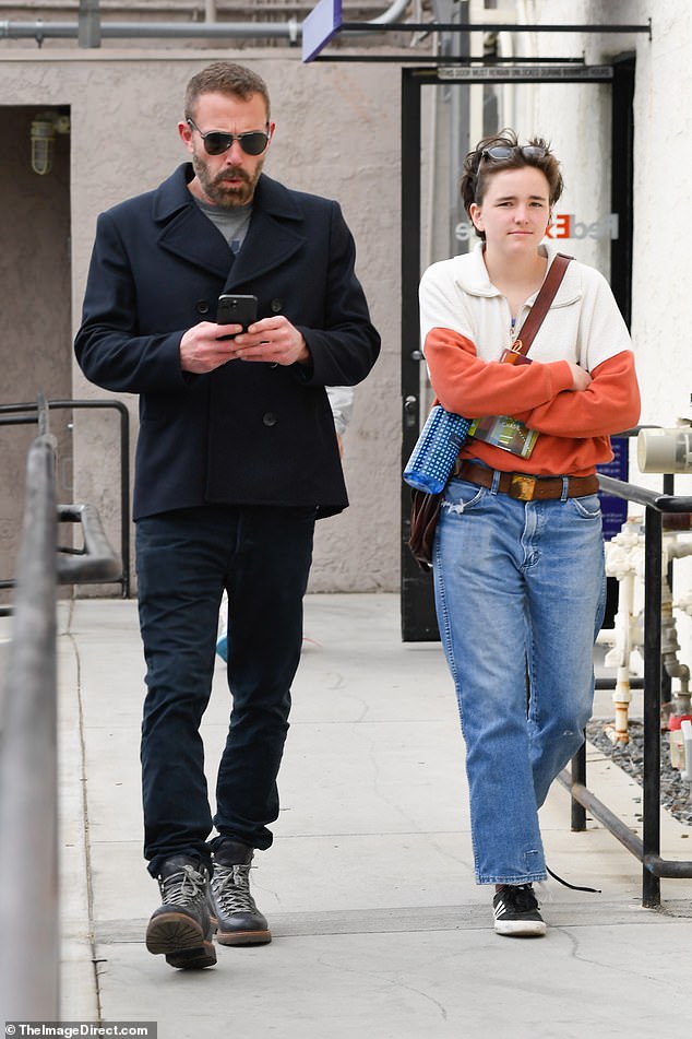 Ben Affleck, 52, was a tad distracted by his cellphone as he spent Saturday afternoon with two of his kids: Fin, 16, and Samuel, 13