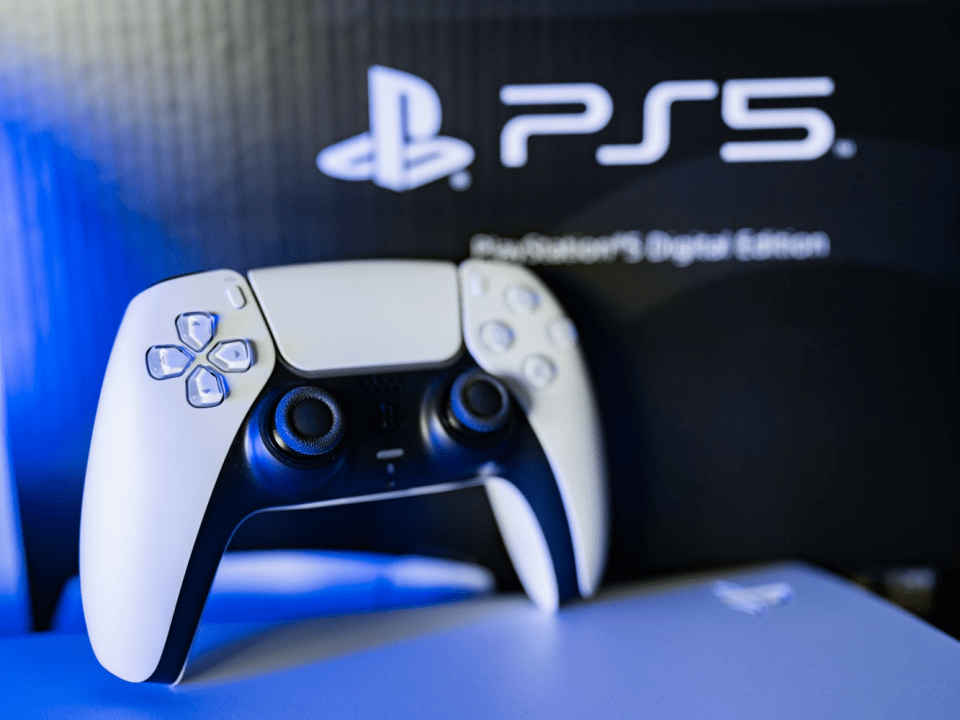 PS5 controller in front of PS5 Digital Edition box.