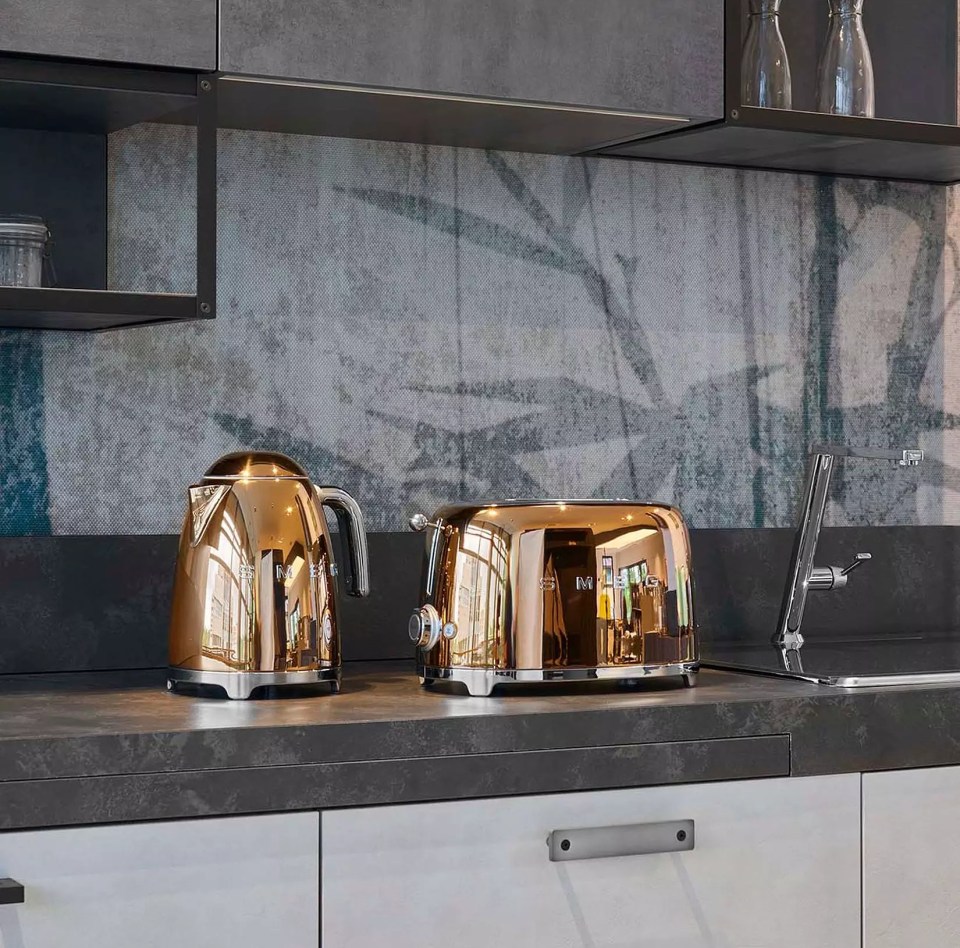 Copper kettle and toaster on a kitchen counter.