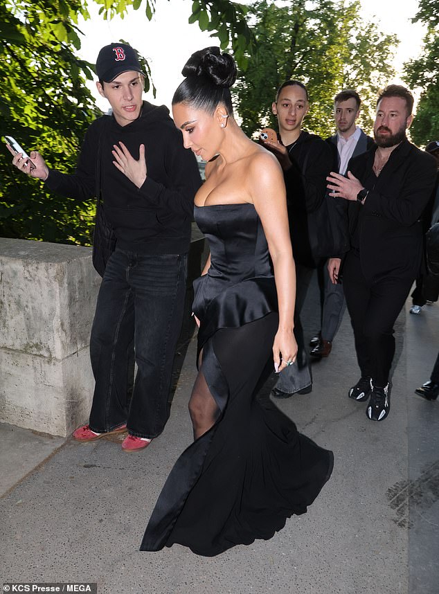 Kim turned heads in a black strapless dress that highlighted her famous curves