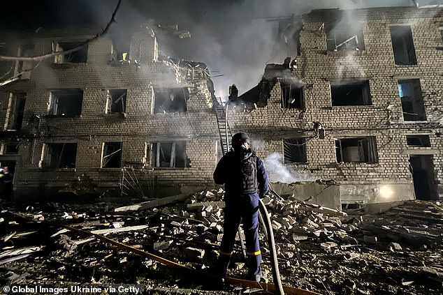 The Cabinet Office is reviewing whether to update Britain's 20-year-old 'homeland defence plan' that sets out how the Government responds to a declaration of war, reports The Telegraph. Pictured: Rescue workers conduct a search and rescue operation at a residential building heavily damaged by Russian drone strikes on May 1