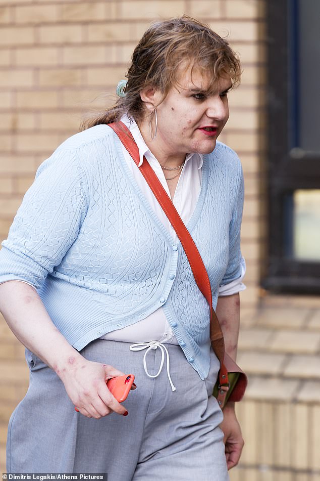 Katie Wallis - who in 2022 became Britain's first transgender MP - arrived at court in Cardiff today over allegations of harassing her ex-wife