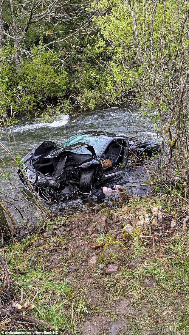 Tragic images show the black Ferrari 488's remains laying in the Yuso river
