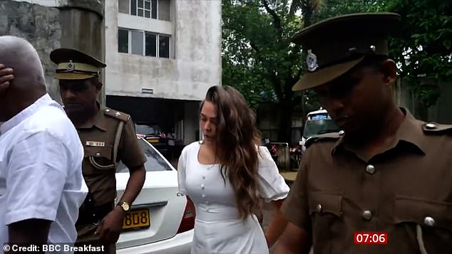 Charlotte May Lee flanked by police today after she appeared in court on drug smuggling offences