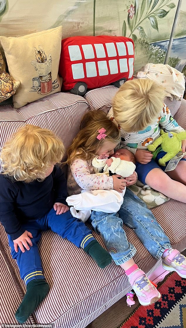 Carrie Johnson has shared a new image of baby daughter Poppy getting acquainted with her siblings Romy (centre), Frank (left) and Wilfred (right)