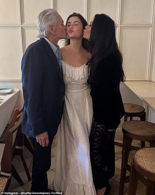 Catherine Zeta-Jones, 55, shared a snap of her and Michael Douglas, 80, kissing their daughter Carys, 22, on both cheeks as she marks the end of her studies at Brown University