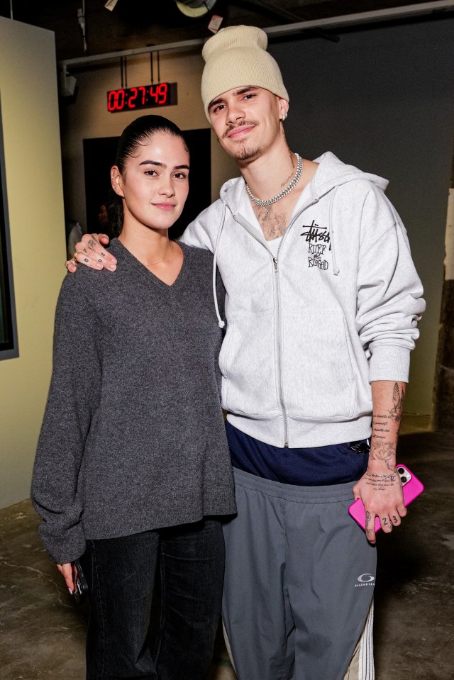 Kim Turnbull and Romeo Beckham at an event.