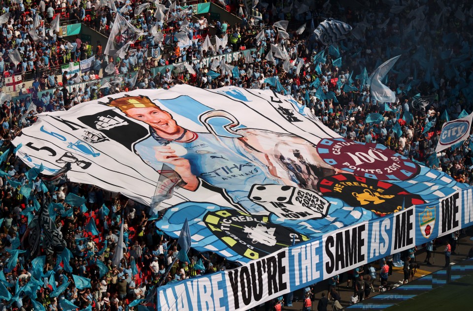 Large banner depicting a soccer player with a crown, trophies, and the text "Maybe you're the same as me we".