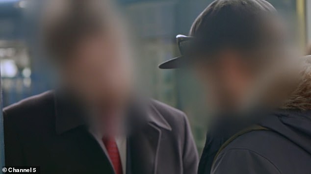 A South Western Railway revenue protection team speak to the fare evader at London Waterloo