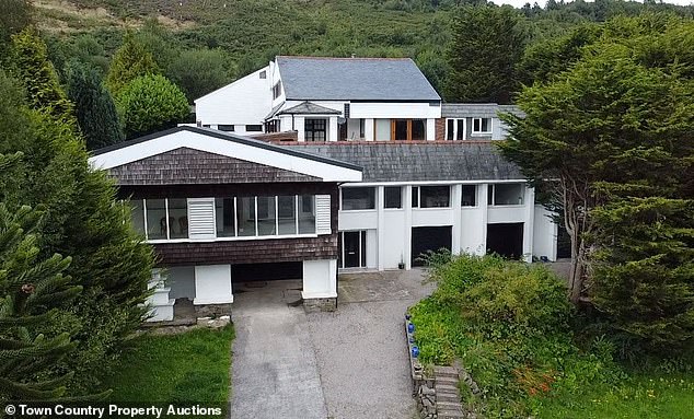 Adam and Laura Drew purchased the 11-bedroom mansion for £500,000 and swiftly installed the gates for their 'security'