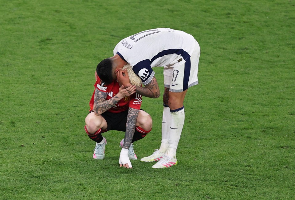 Cristian Romero consoling Alejandro Garnacho on the soccer field.