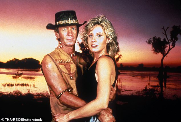 A source exclusively shared an update about retired actress Linda Kozlowski (right), known for her role in 1986's Crocodile Dundee opposite Paul Hogan (left)