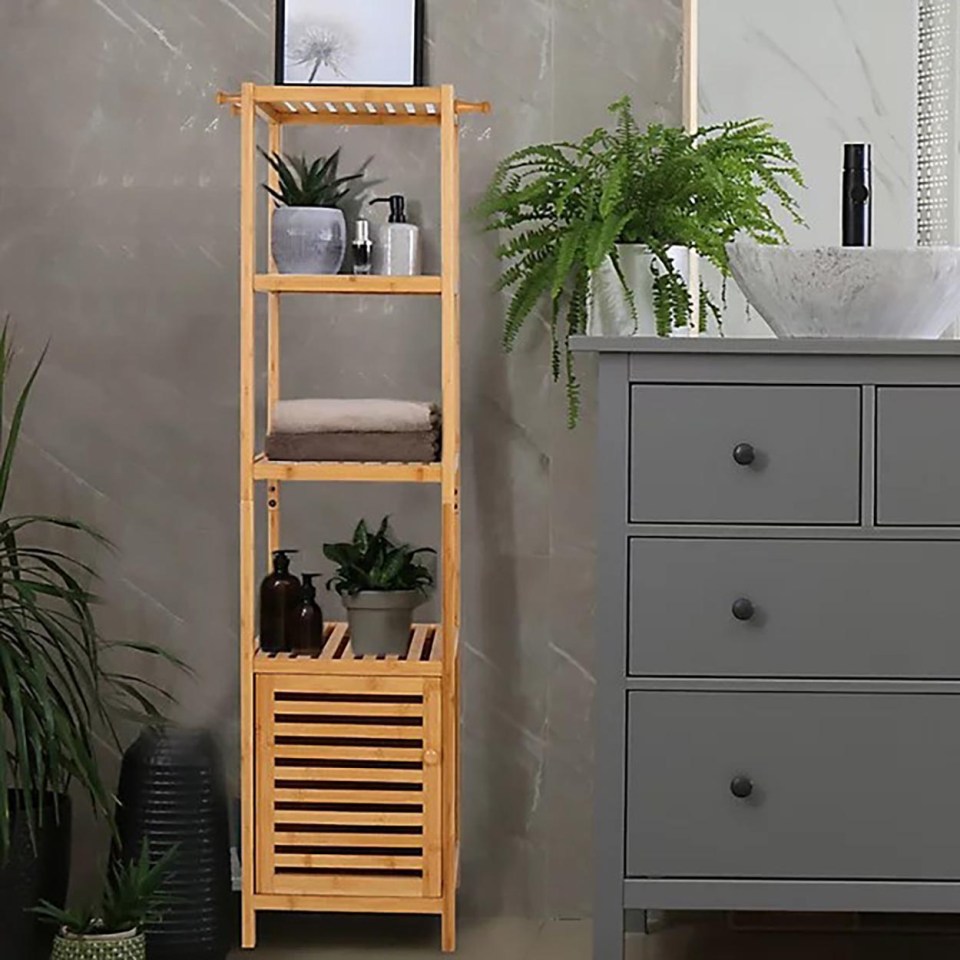 Bamboo bathroom cabinet with shelves and a cabinet door.
