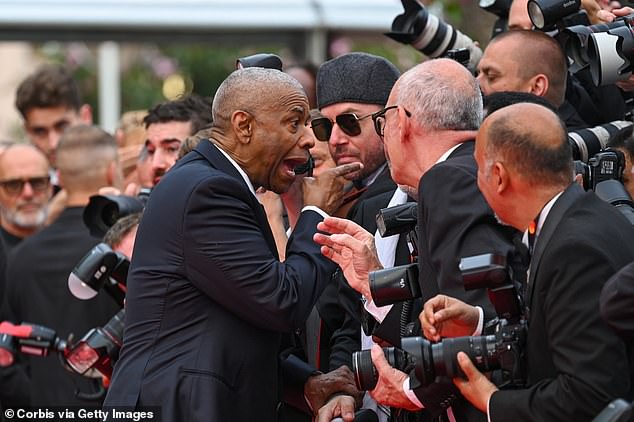 Denzel Washington lashed out an over-zealous photographer as he attended the Cannes premiere of his movie Highest 2 Lowest on Monday