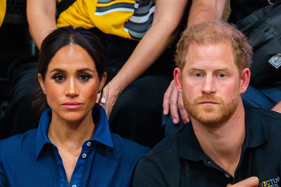 Prince Harry and Meghan Markle sitting together.