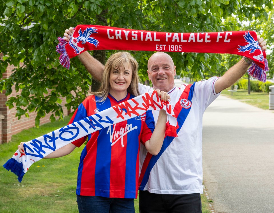 Crystal Palace fans holding scarves.