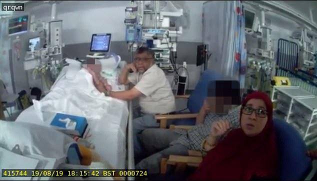 Rashid Abbasi, his wife Aliya and another relative, are seen at Zainab's bedside as police enter the ward