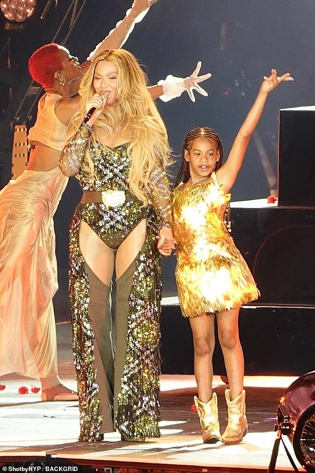 And let's not forget little sister, Rumi (pictured on stage with Beyoncé) who just turned eight this month. Beyoncé certainly hasn't, dragging the poor child on stage to join her for a schmaltzy, syrupy ballad, 'Protector.'