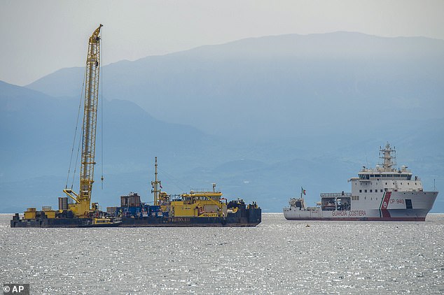 Pictured: the Italian Coast Guard's Luigi Dattilo CP940 patrol vessel (right) assists Hebo Lift 2 (left) at the site