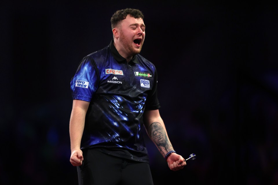 Josh Rock of Northern Ireland celebrates a darts win.