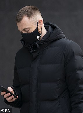 Ross O'Donoghue is pictured arriving at the Rolls Building, at the High Court in central London, in 2022