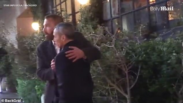 He was seen saying goodbye to a friend and giving him a quick hug before heading back to his car at the valet stand