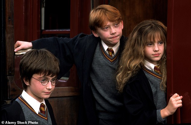 Emma, 35, played Hermione for ten years in the Harry Potter film series, and now her dad Chris has told of how he worked hard to keep her 'grounded.'(Daniel Radcliffe, Rupert Grint and Emma pictured in the first film)