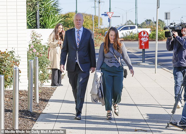 Simon Patterson and his media representative Jessica O'Donnell enter the Latroba Valley law courts on Friday