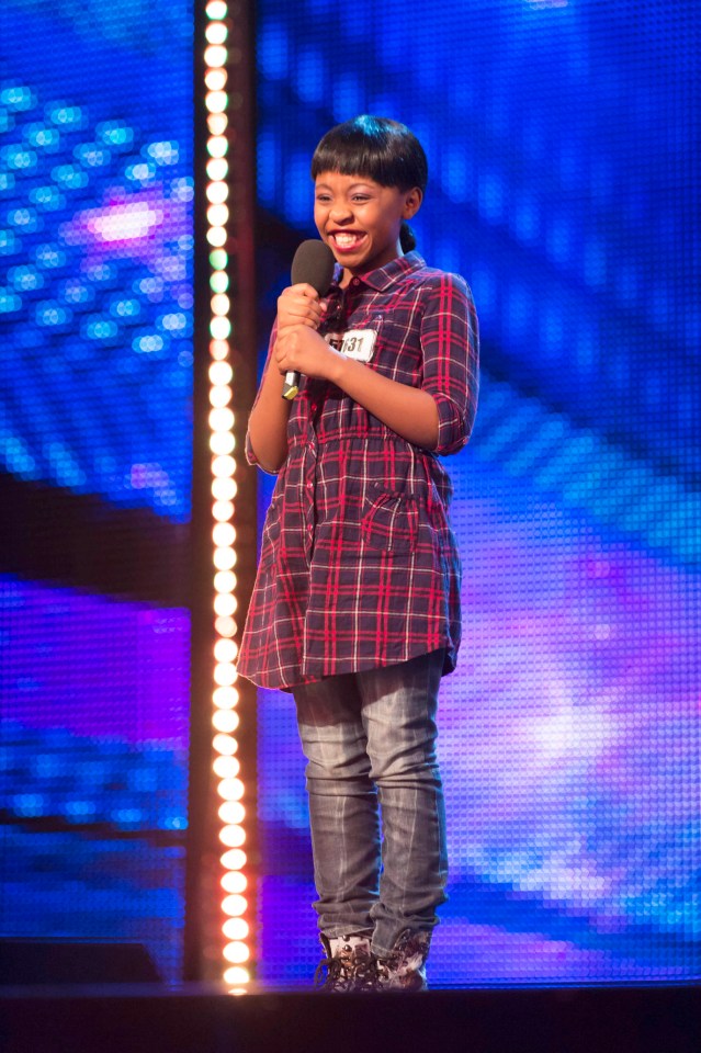 Asanda Jezile, Britain's Got Talent semi-finalist, holding a microphone.
