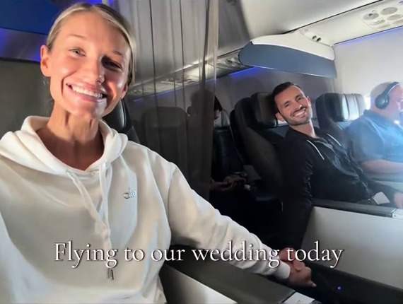 Couple on a plane flying to their wedding.