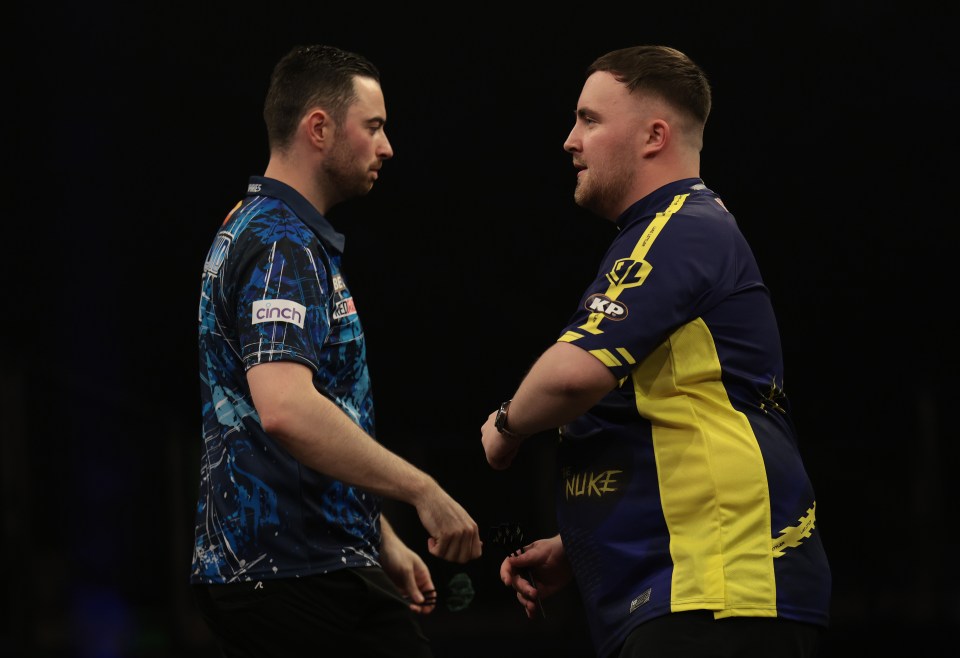 Luke Humphries and Luke Littler at a darts match.