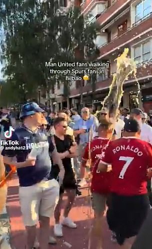 The two Man United fans were drenched in beer as they walked through Bilbao's streets