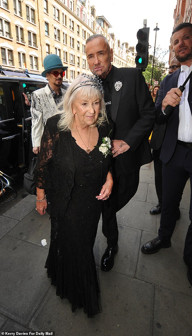 DJ Fat Tony and his partner Stavros Agapiou are tying the knot in a lavish ceremony in London on Saturday, and the DJ was seen arriving (pictured with Boy George and his mother Dawn)