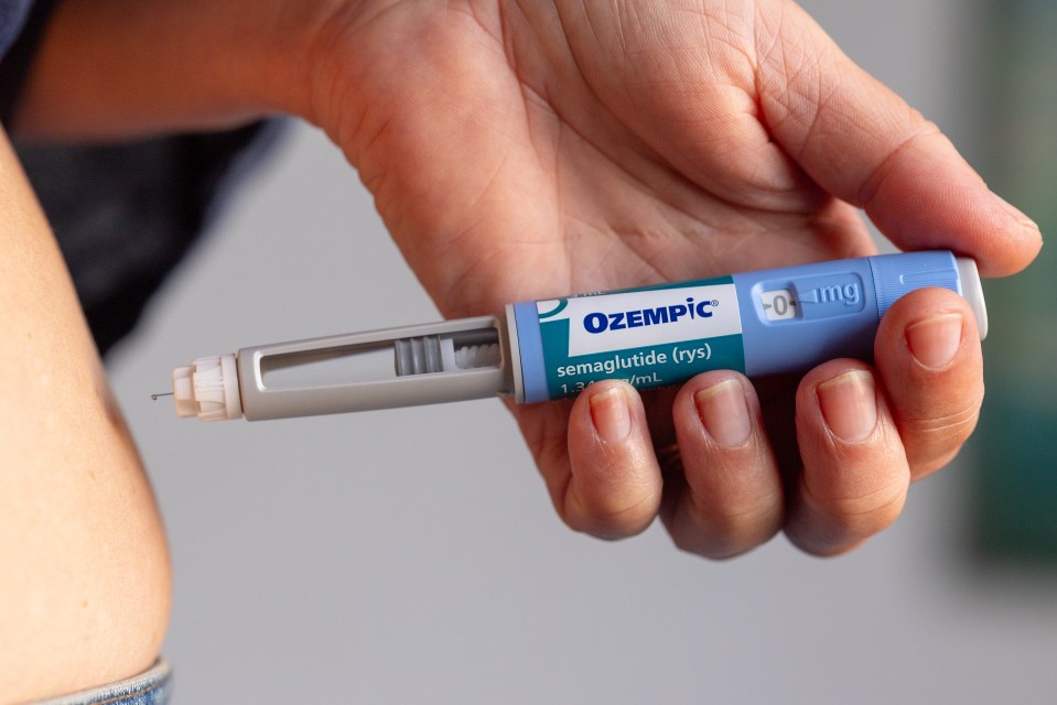 A person injecting Ozempic.