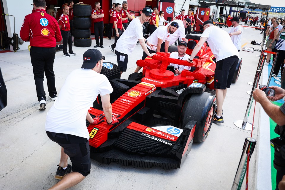 Lego Ferrari Formula 1 race car with crew.